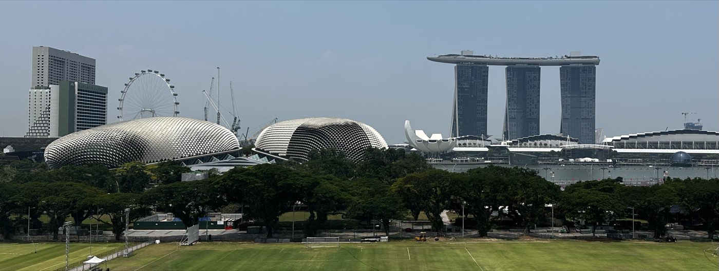 The Esplanade and Marina Bay Sands seen across the Padang